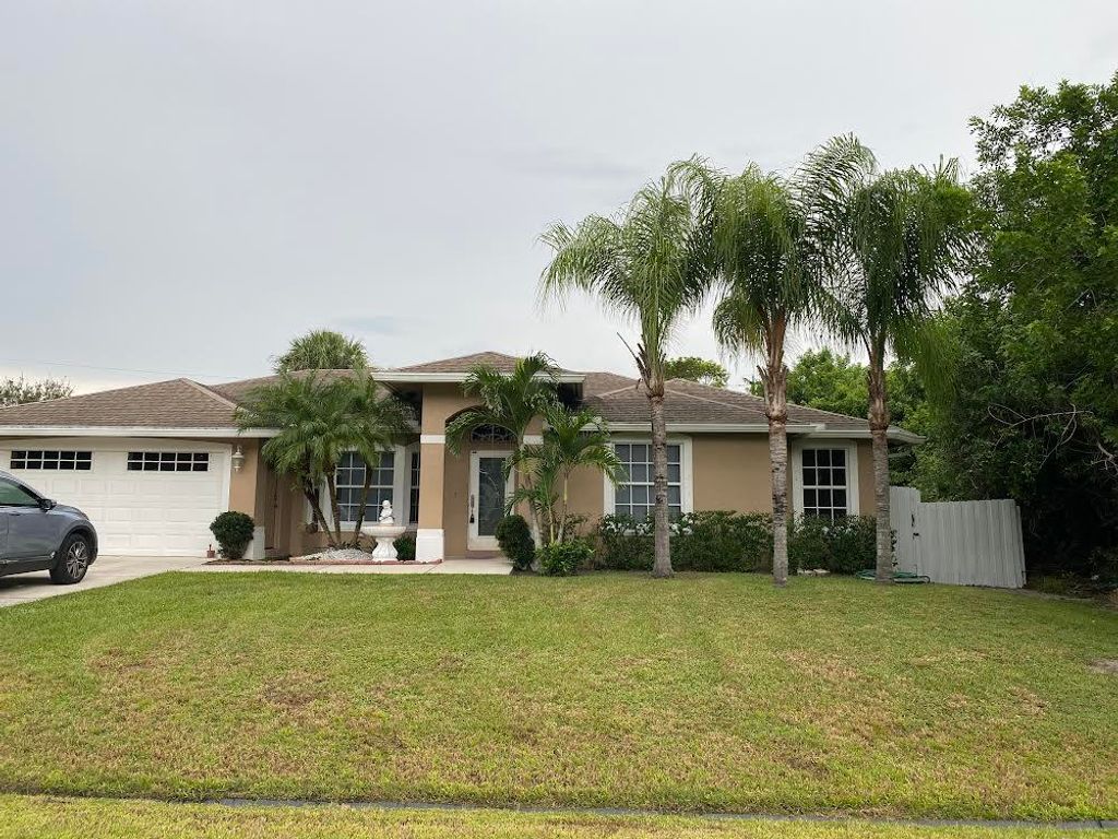Photo of 3770 SW Darwin Boulevard, Port Saint Lucie, FL 34953 (MLS # R10917145)