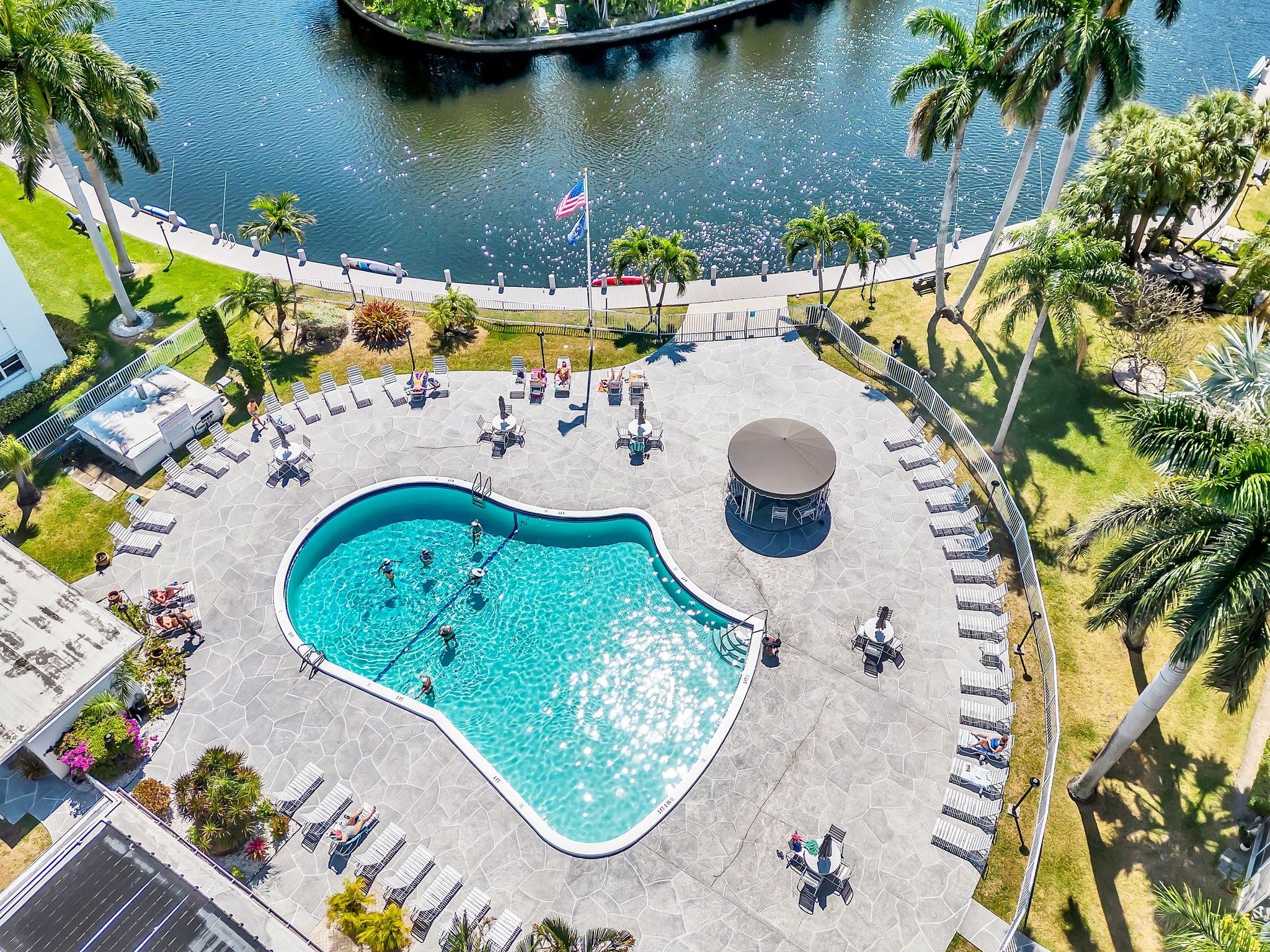 Experience resort-style living in this stunning 2-bedroom, 2-bathroom 4th-floor condo! Boasting breathtaking
waterfront and pool views, this condo offers the perfect blend of relaxation and convenience. The spacious open
floor plan features abundant natural light, updated finishes, and a private balcony overlooking the serene tropical
landscape. Enjoy access to a beautifully maintained pool area, lush grounds, and walking paths along the water.
Conveniently located near shopping, dining, and entertainment, this condo is ideal for full-time residents or as a
vacation retreat. Don't miss this rare opportunity to own your slice of paradise!"