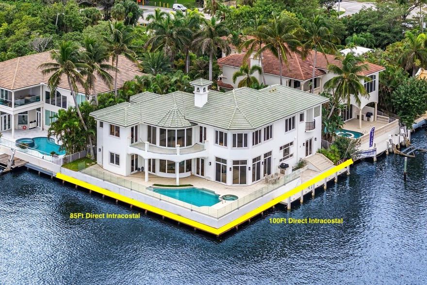 Privately Gated Waterfront Estate with Unmatched Intracoastal Views Nestled on an oversized point lot, this extraordinary estate boasts sweeping, unobstructed Intracoastal views across a stunning 600-foot-wide expanse. A dream for boating enthusiasts, the property features 85 feet of direct Intracoastal frontage and an additional 100 feet along the canal, creating a protected cove perfect for docking your yacht. Inside, the home's thoughtfully designed floor plan offers breathtaking water views from every room and bedroom. The primary suite is a serene retreat, where you can wake up to spectacular sunrises over the water each morning.