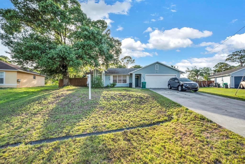 Photo of 1902 SW Aladdin Street, Port Saint Lucie, FL 34953 (MLS # R10802938)