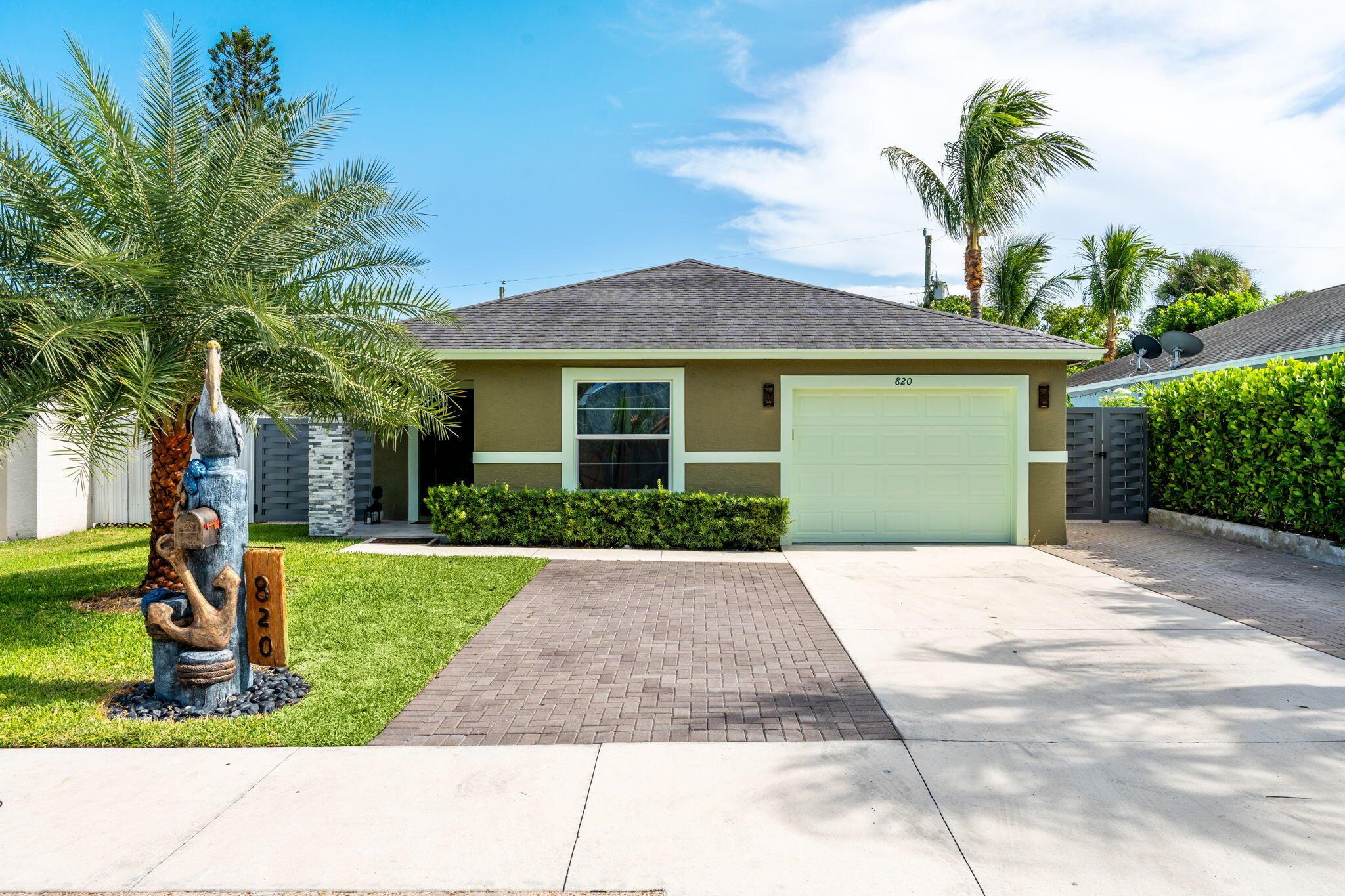 Welcome to this beautifully updated home built in 2017, ideally situated in a highly sought-after West Palm Beach neighborhood just minutes from Downtown, the Beach, I-95, and PBI Airport. Featuring a spacious layout and contemporary upgrades, this property offers convenience, comfort, and versatility. Enjoy stylish new flooring throughout, an upgraded kitchen with modern finishes, and renovated bathrooms that bring a fresh, sleek feel to the home. The converted garage serves as a versatile in-law suite, perfect for guests or and can easily be converted back into a garage if desired. Step outside to a large private patio with an outdoor kitchen, perfect for entertaining or relaxing under the Florida sun. With side entrances for added privacy and no HOA restrictions!