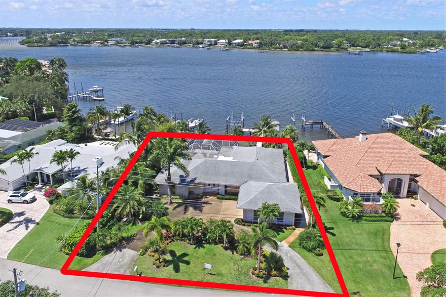 Enjoy wide water views of the scenic Loxahatchee River from this Tequesta Country Club home! Remodel existing structure or build your dream home in one of Tequesta's most desired communities.