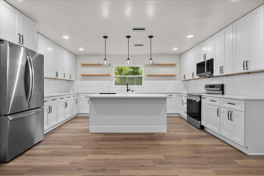 Beautifully renovated 4BR/3.5BA home in the heart of Lake Park. This property features a 2025 roof, a spacious open concept kitchen with quartz countertops, new cabinetry, and modern finishes throughout. The split bedroom layout offers comfort and privacy, while the fully fenced backyard and brand new landscaping create the perfect outdoor retreat. Move in ready with every detail updated for today's lifestyle.