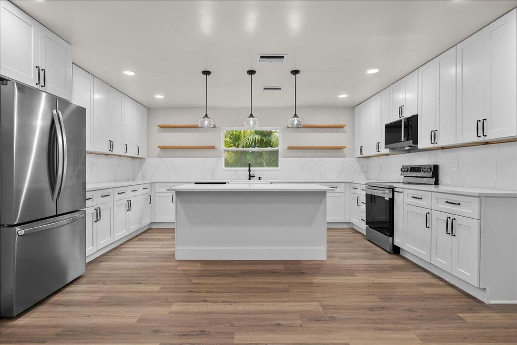 Photo of 426 Bayberry Drive, West Palm Beach, FL 33403 (MLS # B26018403)