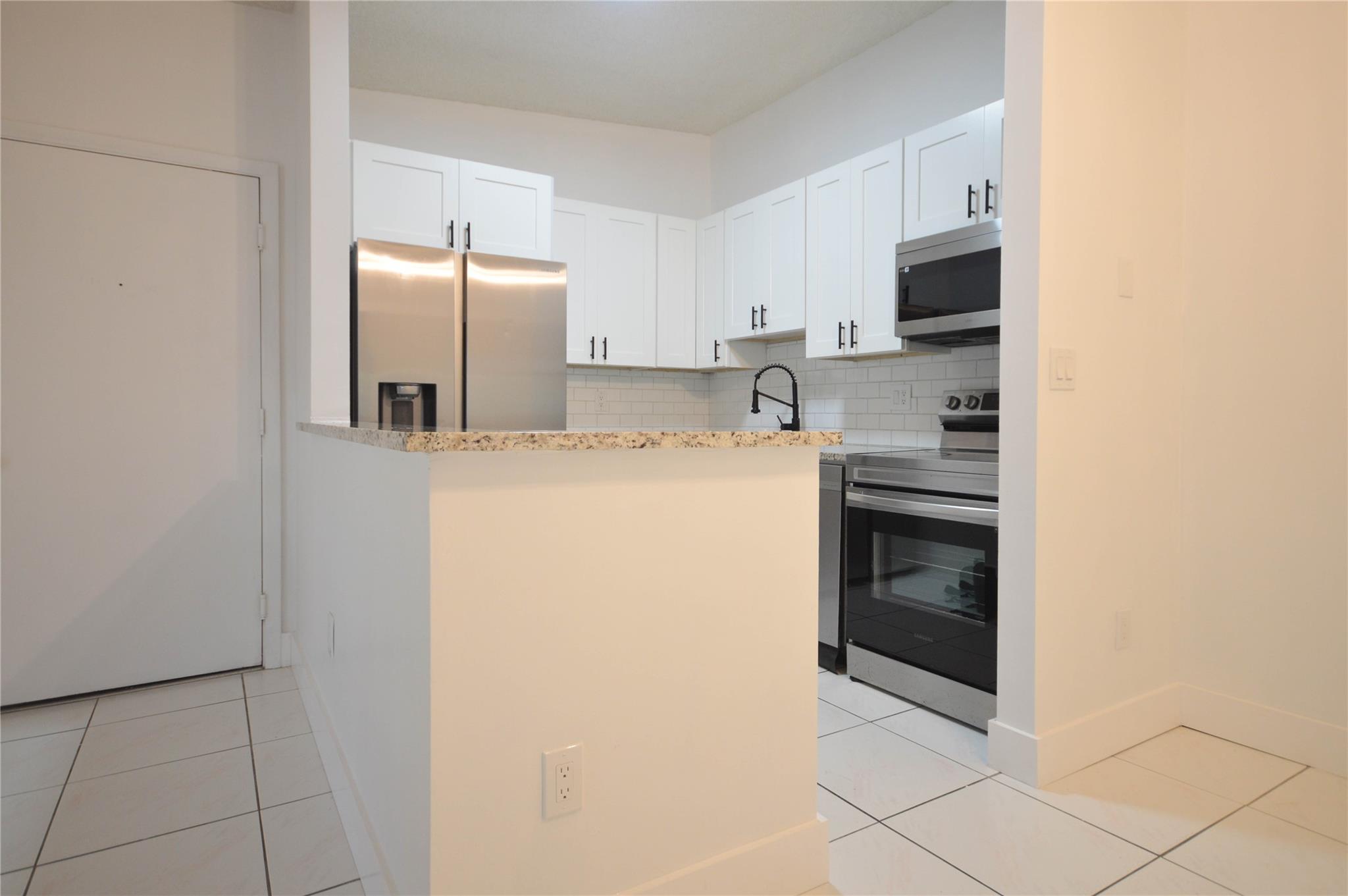 TAMARAC GARDENS CONDOMINI - Residential Lease