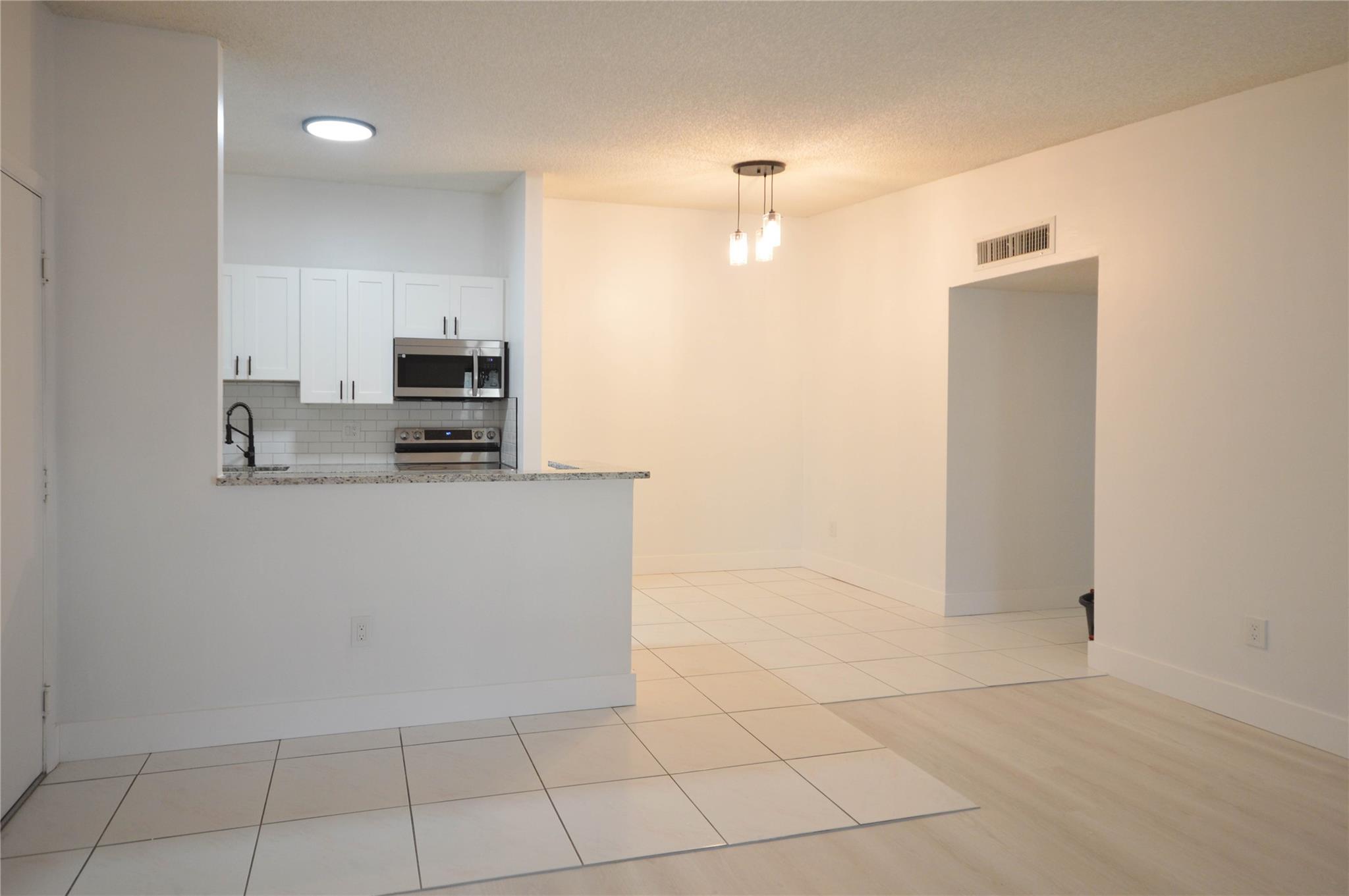 TAMARAC GARDENS CONDOMINI - Residential Lease