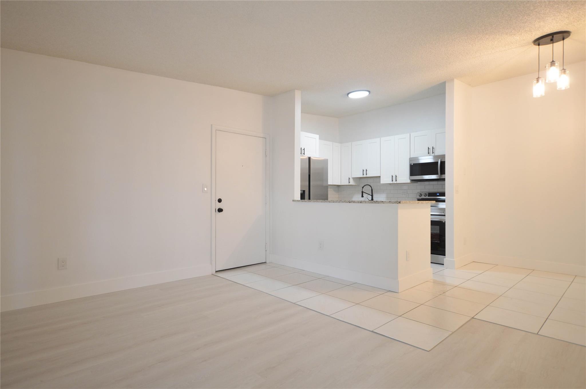 TAMARAC GARDENS CONDOMINI - Residential Lease