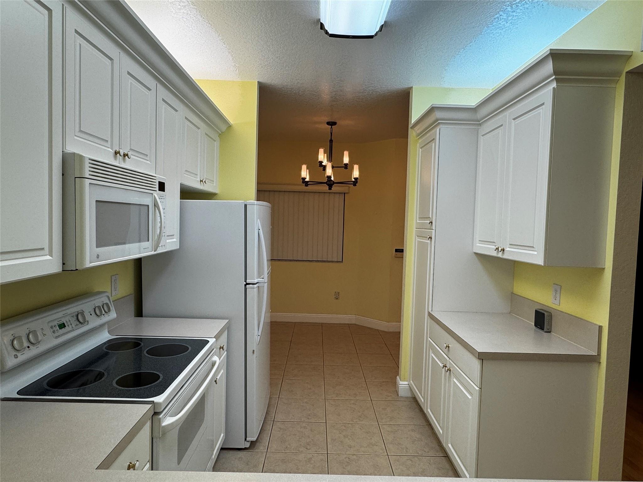 Discover this beautiful unit with convenient features, including a full-size washer and dryer, 10-foot ceilings, impact-resistant windows and doors, a breakfast nook, ceiling fans, and ample storage. Enjoy the flexibility of no minimum down payment, no rental restrictions, and no special assessments—an excellent opportunity!