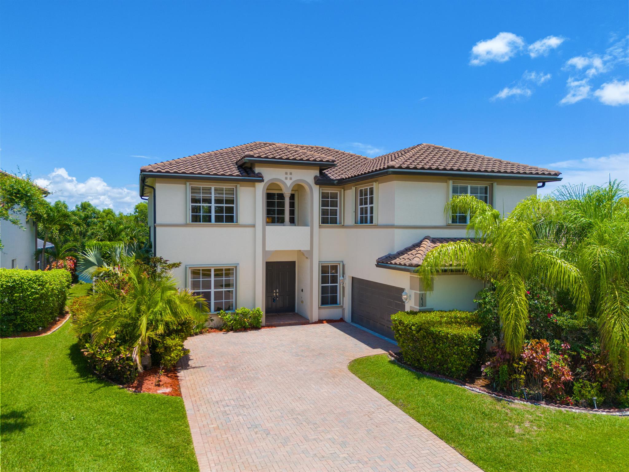 Nestled within the gated enclave of Newport Isles, this two-story, 3,516 square-foot residence will impress with extravagant lakefront and pool views. Highly renovated, the kitchen is detailed with quartz countertops, stainless appliances, gourmet wall oven and elegant touches. With a perfect layout for entertaining, you can have fireplace views while just steps out to the pool. A downstairs bedroom--ideal for guests or a home office--shares easy access to a full bathroom. Upstairs, four additional bedrooms branch from a spacious landing that incorporates a media room and loft. The primary suite features dual walk-in closets, an en-suite bath with Roman tub and separate shower, plus a private terrace framing lake views. For a list of all additional upgrades, please see attached list!