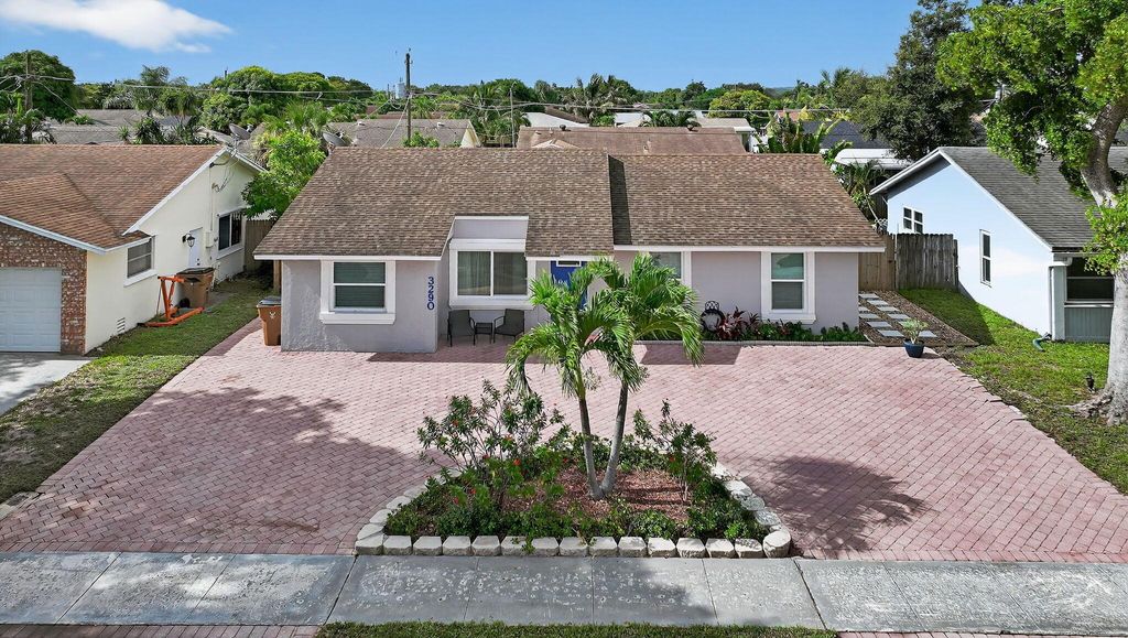 Photo of 3290 SW 2nd Street, Deerfield Beach, FL 33442 (MLS # R11110700)