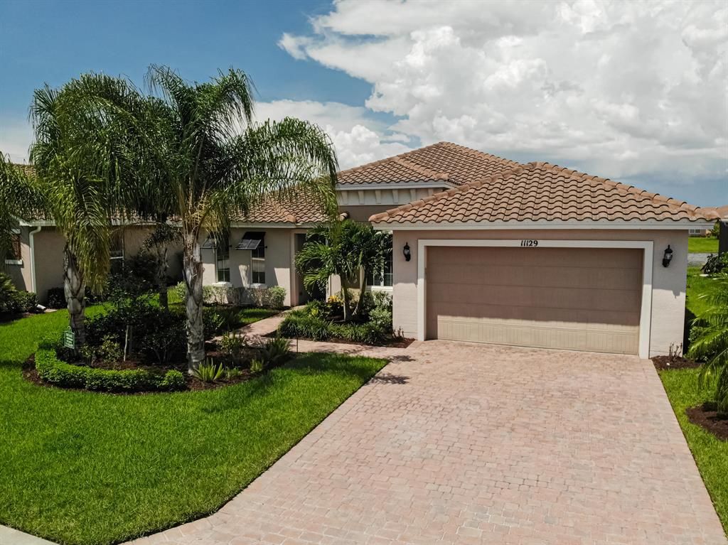 Photo of 11129 SW Maple Tree Lane, Port Saint Lucie, FL 34987 (MLS # R10729796)