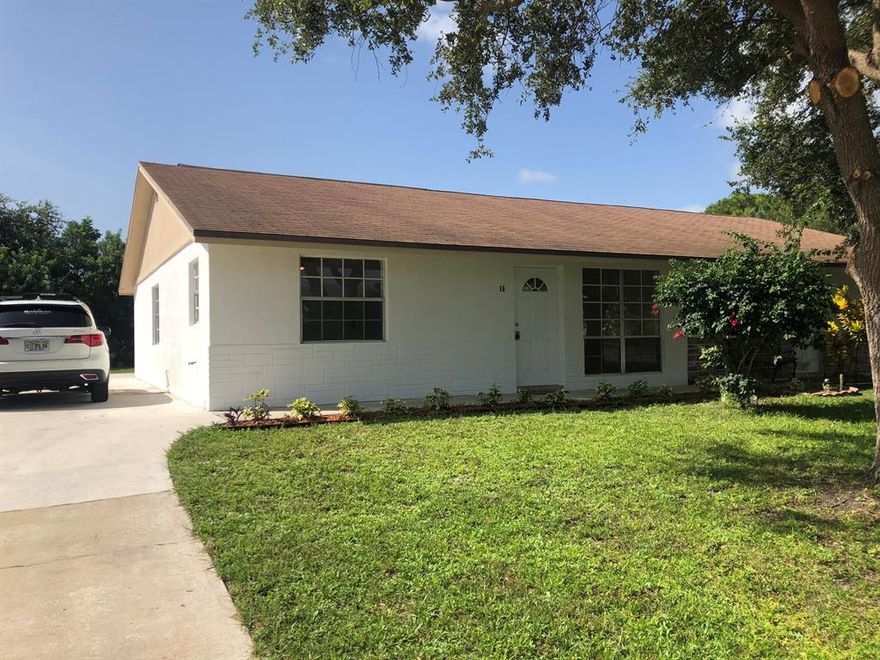Completely remodeled 1/2 duplex located in the heart of Stuart.  New 18 x 18 tile throughout the living area and a brand kitchen with white shaker cabinets. The kitchen features a new microwave, oven and dishwasher all under factory warranty. Upgrade LED lights and fans throughout the unit and updated bathrooms. Oversized driveway and patio with a large back yard. Plenty of room for a shed, boat parking, RV and pets. Close to all major highways and shopping. Owner is a Licensed Florida Realtor.
