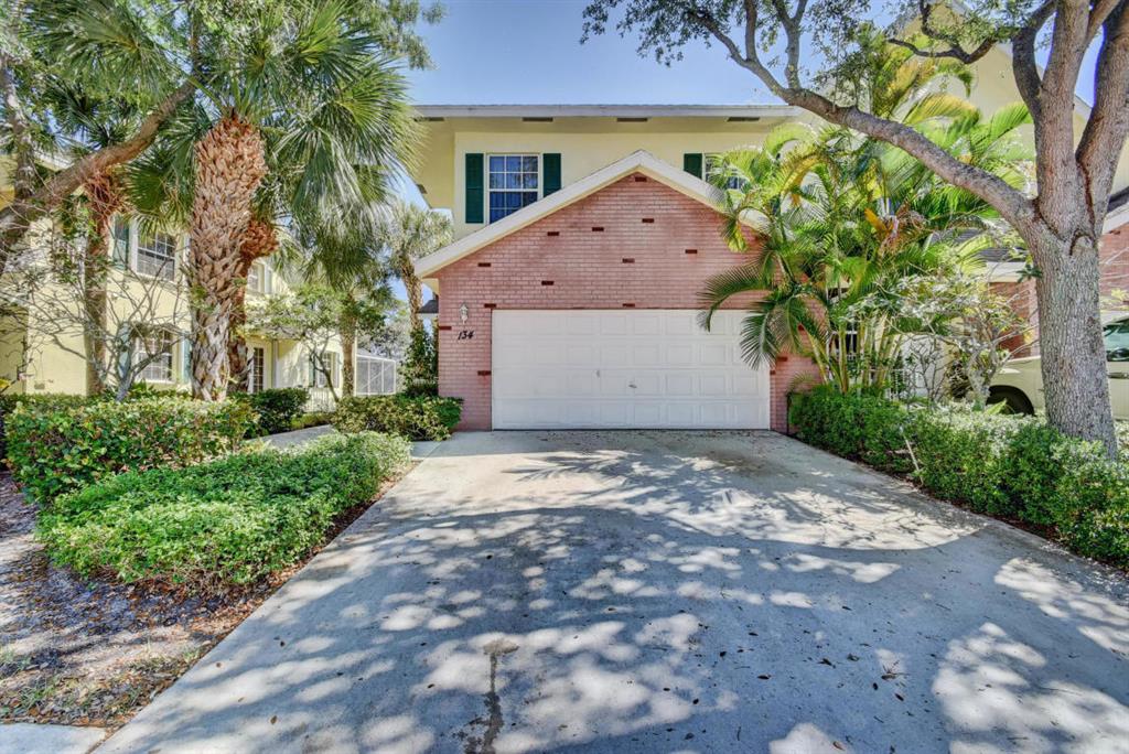 Bright and open floor, three story townhouse in highly desirable Boynton Beach community of Cedar Ridge. This RARELY available corner unit with 2 car garage has been beautifully maintained and boasts numerous, recent renovations including: Hardwood, soft-close cabinets in kitchen, stainless steel kitchen appliances, granite countertops, washer/dryer, bamboo flooring up the stairwell and throughout all 3 bedrooms, AC less than 5 years old, NEW plantation shutters on first floor french doors, NEW accordion shutters on all window openings, NEW wainscoting in lower level recreation room. Energy efficient, natural gas services the stove/oven, hot water heater, dryer, and is piped to the rear patio for gas operated BBQ luxury.