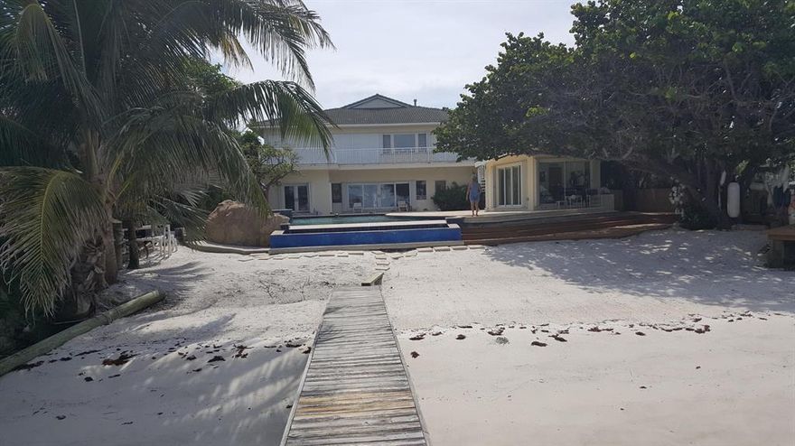 This is an incredible custom home constructed from an existing 1955 CBS home with extensive remodeling in 1997. This amazing home with sandy beach into the intracoastal and dock is impossible to duplicate and must be visited. Totally private, sitting on an acre. a separate rental house on the property pays the real estate taxes and there is a back up generator.