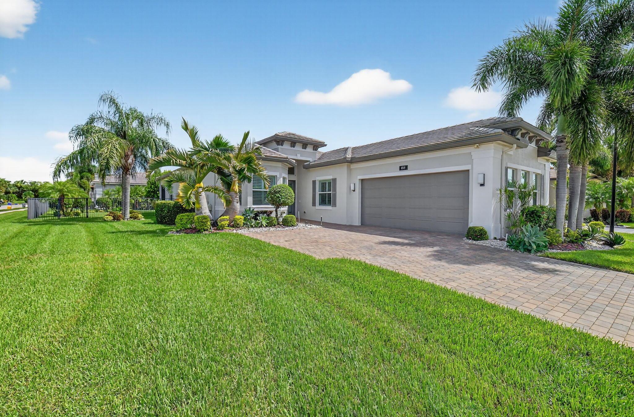 This rarely available ''Vienna'' Model is situated on a oversized Corner Lot with fenced back yard.. Home has 2 Bedrooms plus den that can be used as a 3rd bedroom.Coffered ceilings. Large upgraded Kitchen is open to the Dining room & Spacious Great Room including Quartz Countertops with modern white cabinetry, transom window & Stainless appliances. The Elegant Master Suite boasts a coffered ceiling, two walk-in closets, Roman tub & separate shower. Entire home has Impact windows & doors, private screened patio, plug in generator. The Vienna Model features a 2 car garage. Monthly maintenance includes alarm monitoring, privately manned guard gate, cable package, and use of all amenities. Valencia Bay is a 24-hour guard gated active over 55 community with a Monthly maintenance include