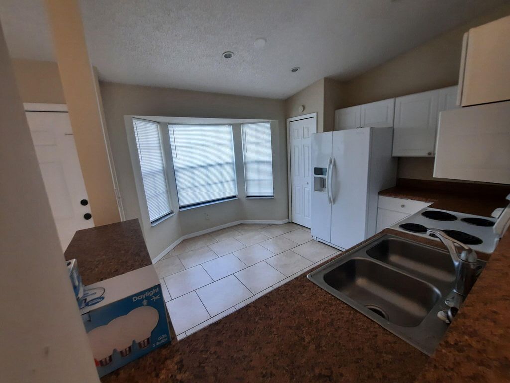 Photo of 3912 SW Mccrory Street, Port Saint Lucie, FL 34953 (MLS # B26022217)