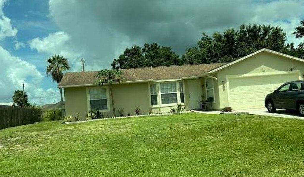 Photo of 3912 SW Mccrory Street, Port Saint Lucie, FL 34953 (MLS # B26022217)