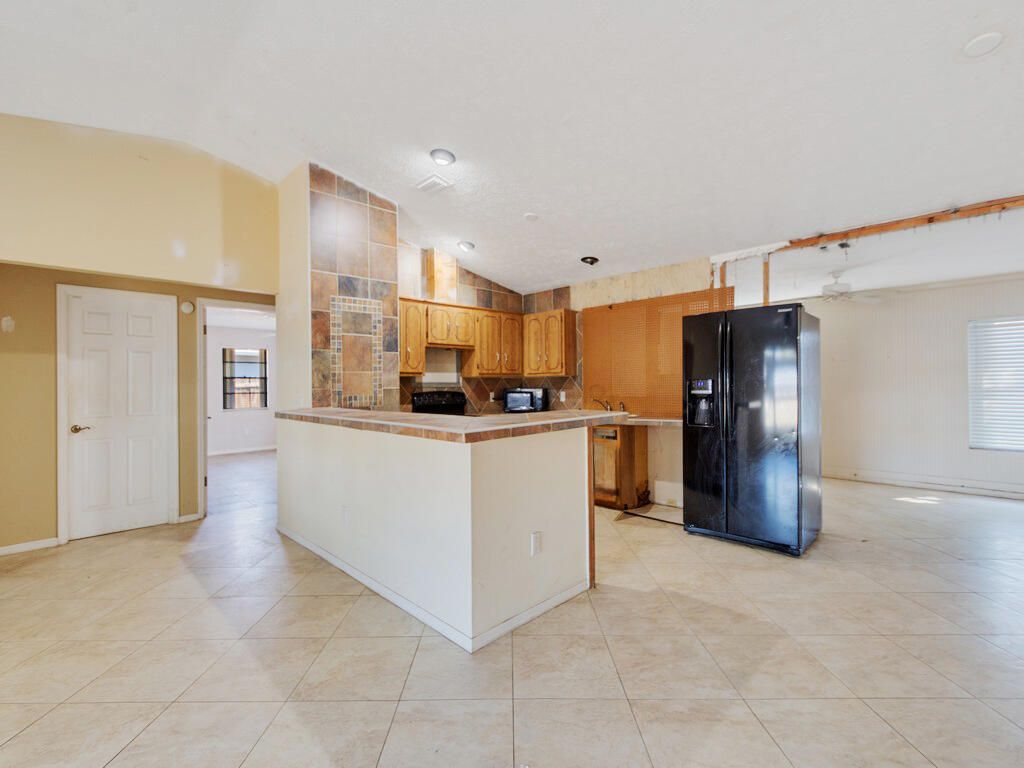 Photo of 502 NW Goldcoast Avenue, Port Saint Lucie, FL 34983 (MLS # B26002719)