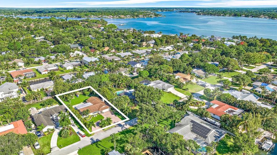 Escape to a luxurious retreat in a Jupiter waterfront community! This exquisite 3/2 CBS home, is nestled on a GIANT.32-acre cul-de-sac lot! Breathtaking sunrises and sunsets illuminate this east-to-west-facing oasis, complete with exterior lighting and lush landscaping. Savor the vibrant local scene with charming shops, restaurants, and pristine dog-friendly beaches just moments away. Explore nearby nature preserves and parks, with easy access to launch your boat or paddle board. Inside, discover a spit floor plan, large rooms, and a spacious lanai with a sprawling front yard, expansive secluded backyard, refreshing pool, and soothing hot tub. Boat/RV storage is ample, and no HOA fees offer unparalleled freedom!! Let's not forget the great schools and awesome neighbors!