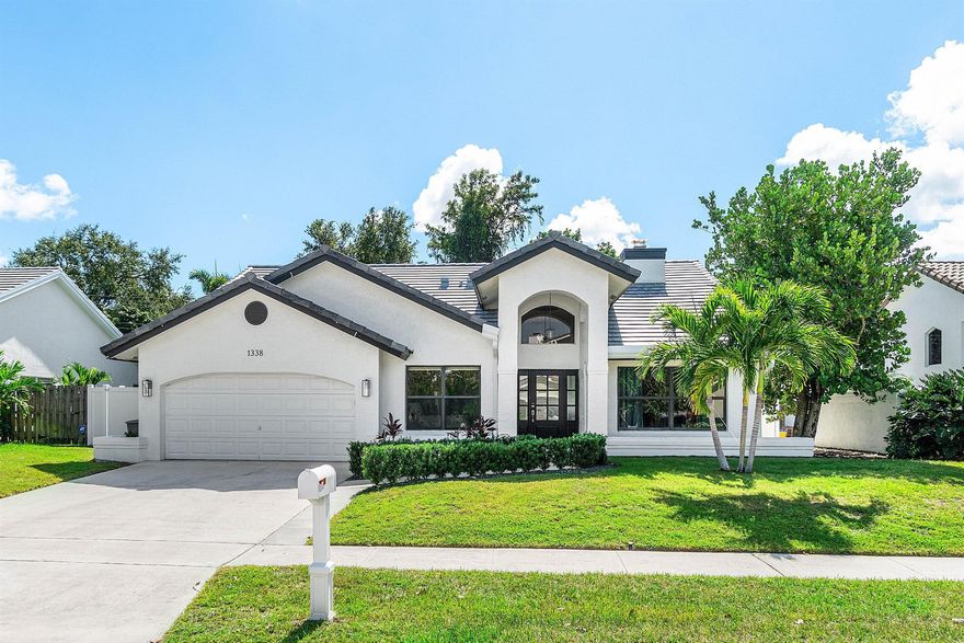 Boca Raton Square Perfection! Completely updated and loaded with upgrades, this immaculate 4-bedroom, 2.5-bath home perfectly combines style, comfort, and functionality. Featuring a bright open floor plan with vaulted ceilings in the living, dining, family, and primary bedroom areas, the home is designed for both everyday living and entertaining. The all-white kitchen is the heart of the home -- equipped with high-end stainless steel appliances, ample cabinetry, and a large island ideal for meal prep and gathering. Thoughtfully selected flooring adds warmth and character, while the spacious bathrooms offer a refined, spa-like experience. Step outside to your private backyard oasis, complete with a sparkling pool with large swim shelf, hot tub, and lush landscaping with new astroturf