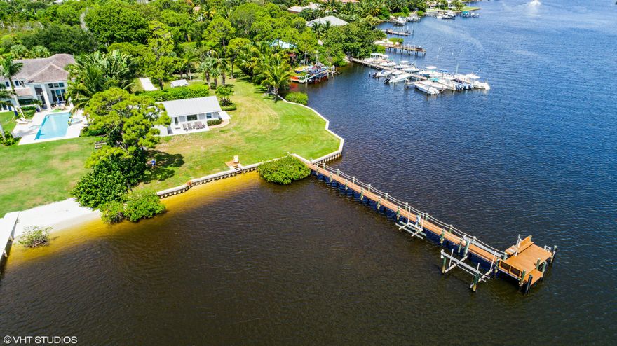 Direct Loxahatchee River - One of the Last True Riverfront Point Building Lot with 270' of ocean access, water frontage on almost 1 ACRE with long river views to the north and east. Breathtaking wide water views can be seen from one of the last remaining large lots directly on a wide part of the beautiful Loxahatchee River with new seawall and dock and boat lift. Live in the extensively updated 3 bedroom, 2 bath home on the property while building your dream, direct riverfront estate.