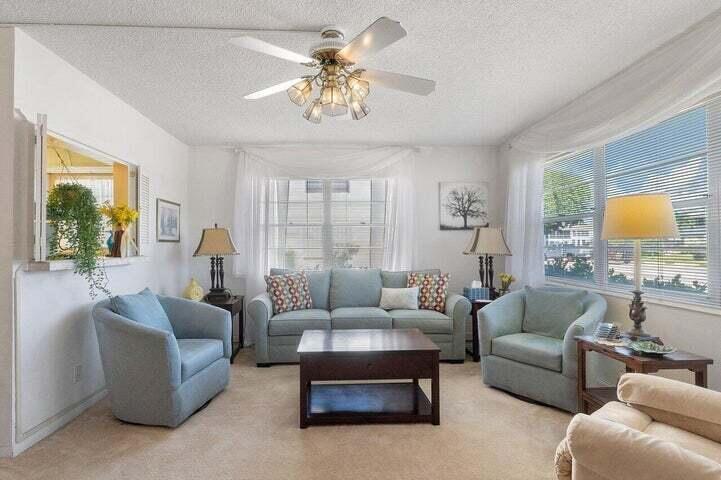 55+ Ground Floor 1B 1.5 Ba Corner Unit. Sold Furnished AS-IS.  Nestled in a quiet area of the community with tranquil canal views and wonderful mature trees. CAC. Move In condition. Can also be delivered Vacant. Priced to Sell. Association has good reserves with building work completed. No rentals for 2 years.