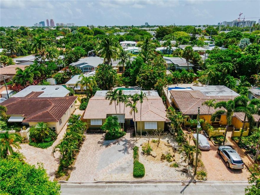 EZ TO SHOW - Seller says "bring ALL offers!" Nicely landscaped pool home with all the amenities! Four bedrooms / two bathrooms (1829 sqft) with an expansive living room overlooking a truly tropical private landscaped sanctuary(minimal maintenance  designed) around a heated pool. Featuring, barrel tile roof, NEW A/C,  new exterior awnings, impact glass, tile / wood floors, updated kitchen, LED recessed lighting, plantation shutters and large closets with extra storage.  Located one of the nicest streets in Poinsettia Heights. Prepare to be impressed!