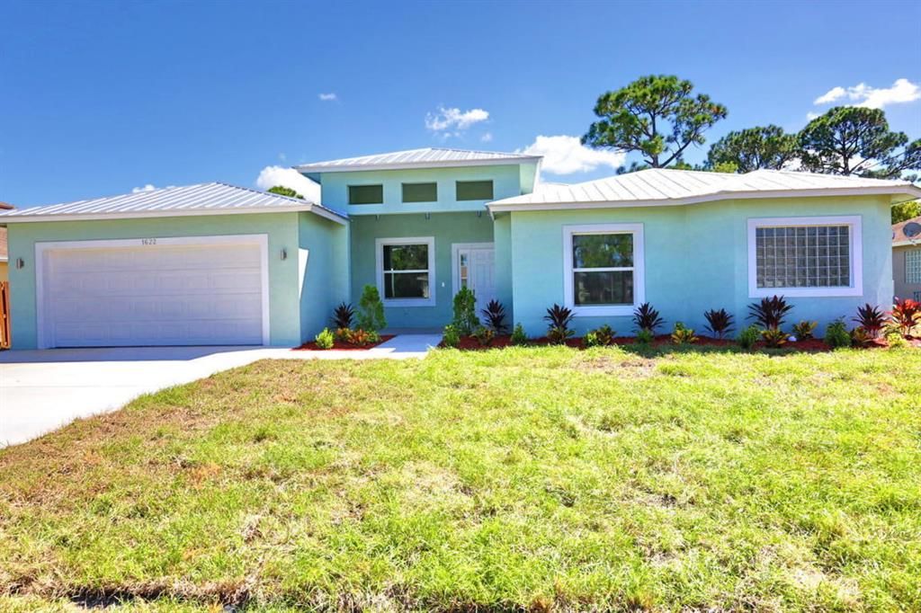 Photo of 349 SW Dagget Avenue, Port Saint Lucie, FL 34953 (MLS # R10765590)