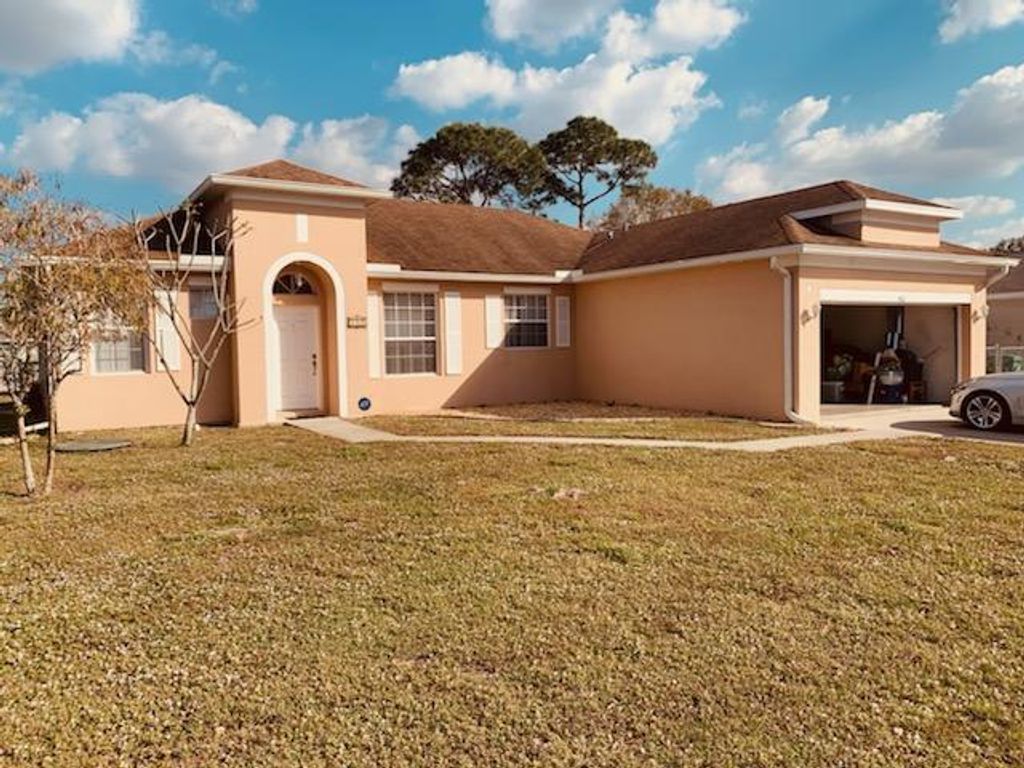 Photo of 421 NE Airoso Boulevard, Port Saint Lucie, FL 34983 (MLS # R10769165)