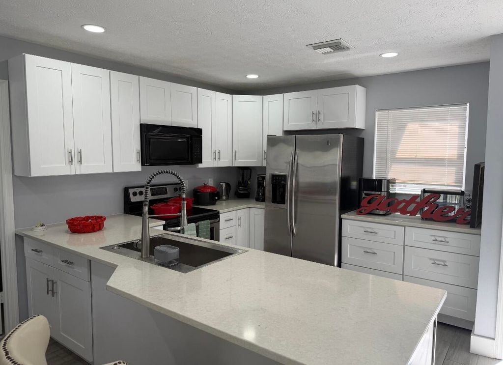 Photo of 1392 Riverside Circle, Wellington, FL 33414 (MLS # B26027080)