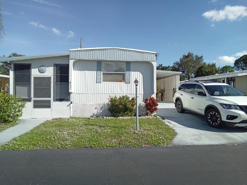Photo of 412 E Erie Drive, Fort Pierce, FL 34946 (MLS # R10852099)