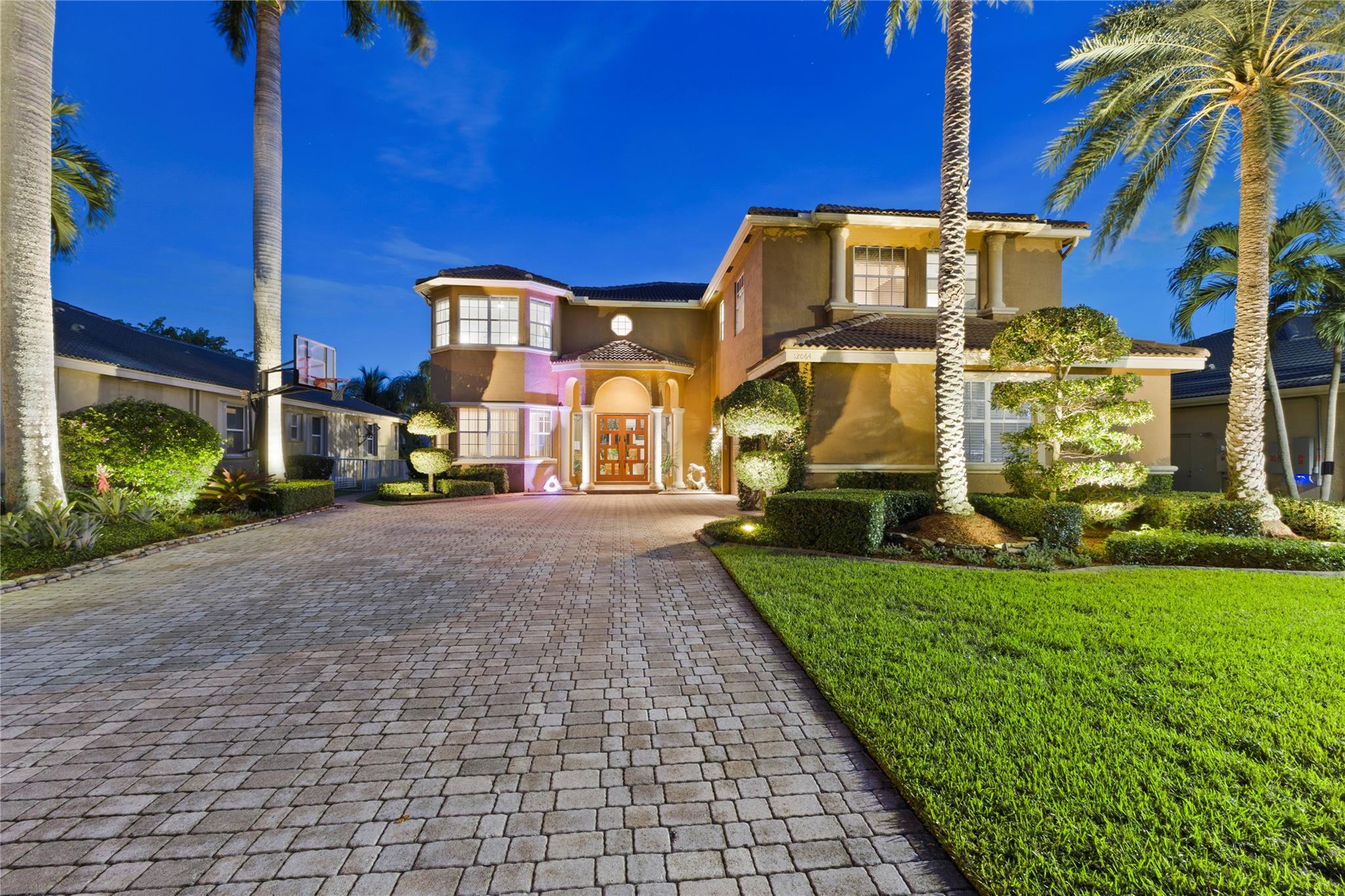 This exceptional lakefront estate offers 6 bedrooms and 5 baths, including two convenient downstairs rooms – perfect for guests, in-laws, or a private home office. Enjoy a freshly redesigned guest suite with cabana bath, new flooring, a new staircase baluster, and a spacious primary suite with custom cedar walk in closet.
Step outside to a resurfaced pool with color-changing water jets, an outdoor kitchen with high end touches, Indonesian teak wood, travertine pavers,firepit, AND putting green all surrounded by lush, meticulously landscaped grounds.
The oversized 3-car garage is fully upgraded with spray foam insulation, custom workbench, slat wall system, hurricane-rated door, and MyQ smart technology. This home is move-in ready and filled with thoughtful upgrades from top to bottom.