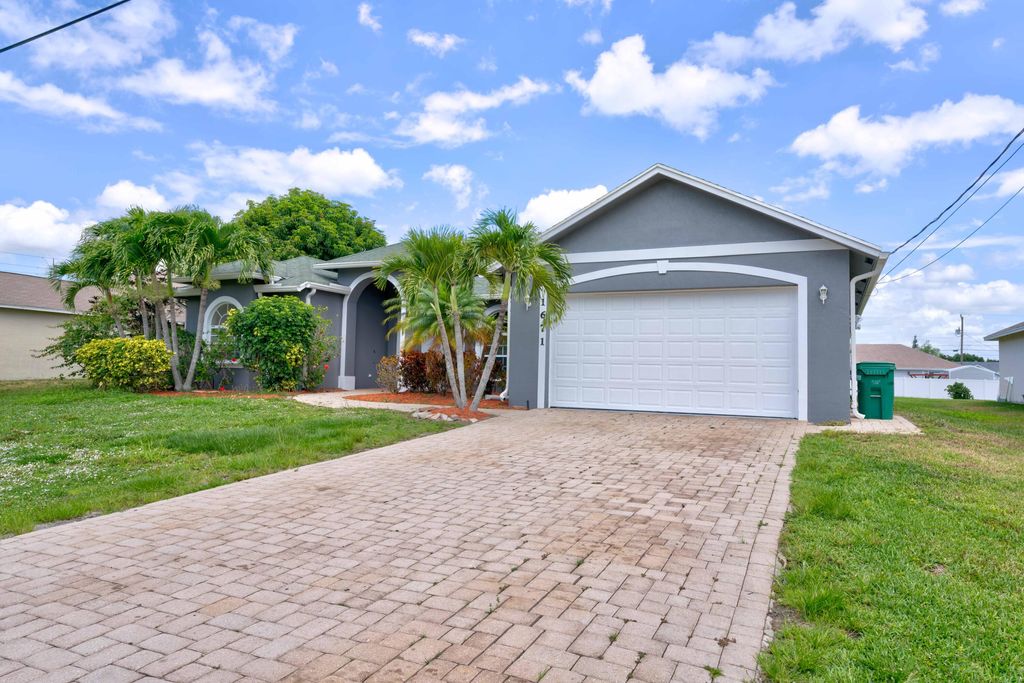 Photo of 1671 SW Aledo Lane Ln, Port St Lucie, FL 34953 (MLS # R10803278)