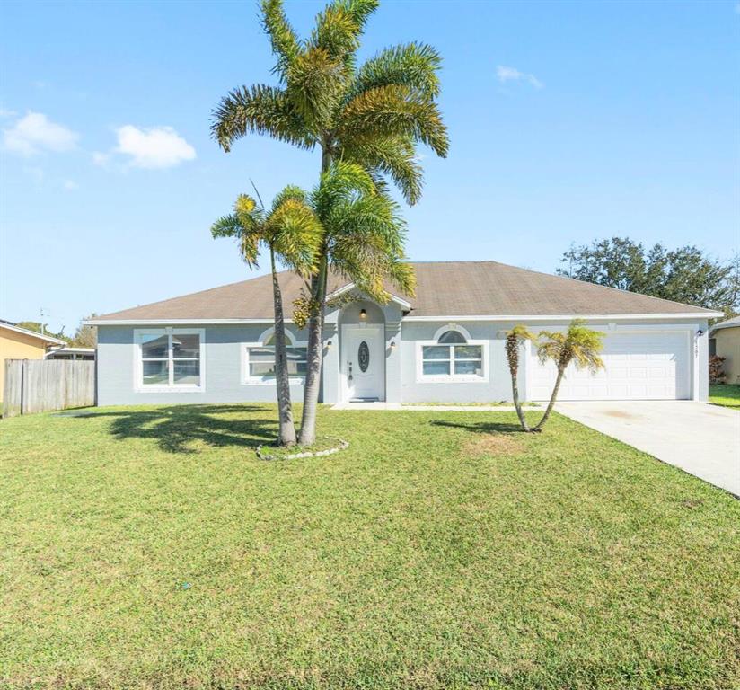 Photo of 1207 SW Curry Street, Port Saint Lucie, FL 34983 (MLS # R10744153)