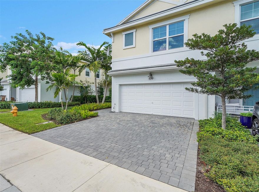 Welcome to this beautifully designed townhome featuring three spacious bedrooms plus a versatile bonus room, perfect for a home office, media room, or guest room. Offered fully furnished.    Nestled in the heart of Deerfield Beach, you're just minutes from pristine Florida beaches, upscale shopping, fine dining, and convenient transportation. Built in 2023, this home boasts premium finishes throughout including a gourmet island kitchen with quartz countertops, upscale lighting fixtures, wood-look tile flooring in all living areas, and impact windows and doors for security, protection and energy efficiency.  Step outside to your private paver patio overlooking a tranquil lake. Whether you are seeking luxury, location, or lifestyle--this townhome delivers it all.