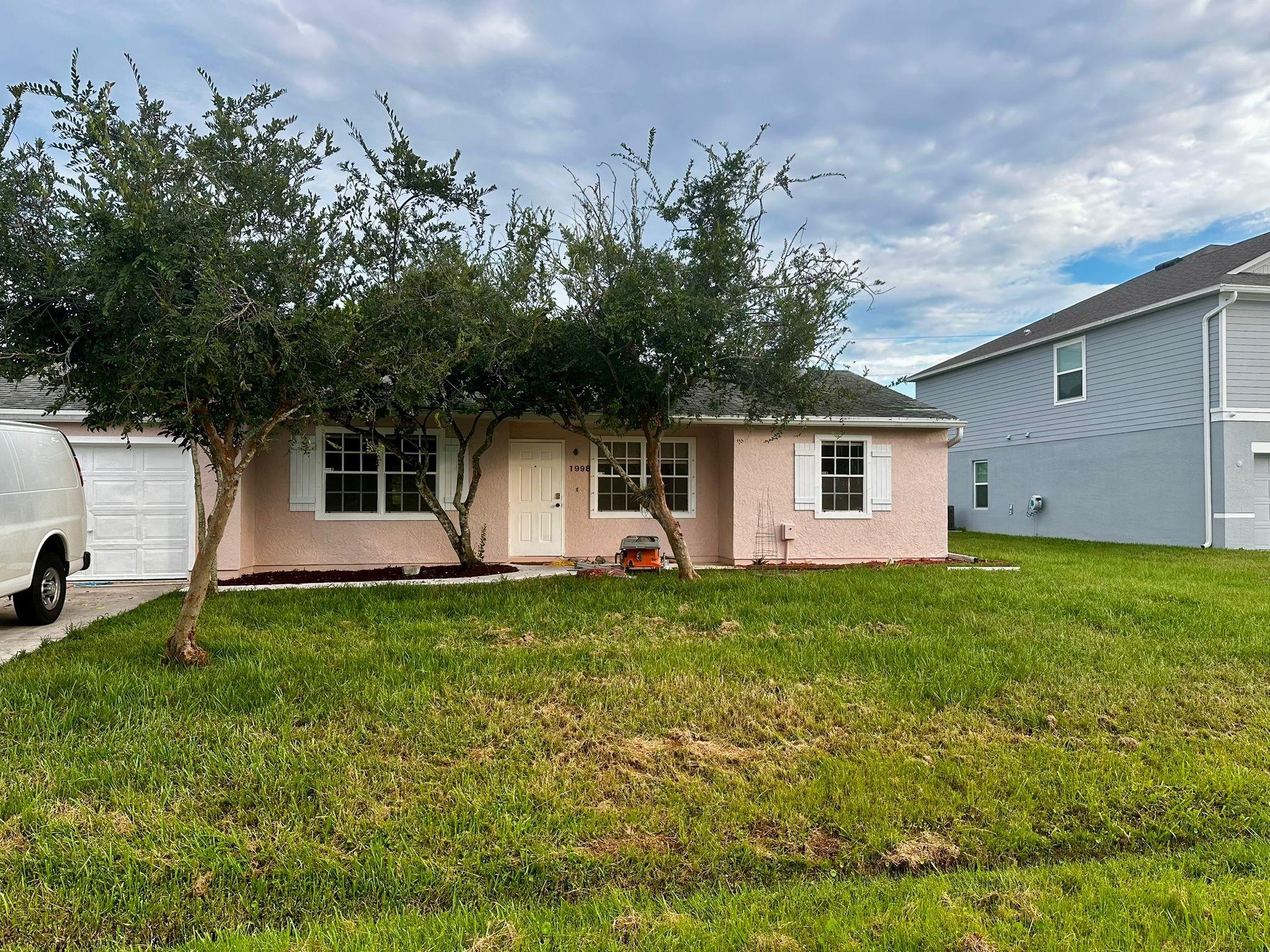 Cozy 3-bedroom, 2-bath home with a 1-car garage in East Port St. Lucie! Just a quick drive to the beach and all the best local spots. Sitting on a big corner lot, the backyard comes with a deck that's perfect for hanging out, grilling, or just relaxing.