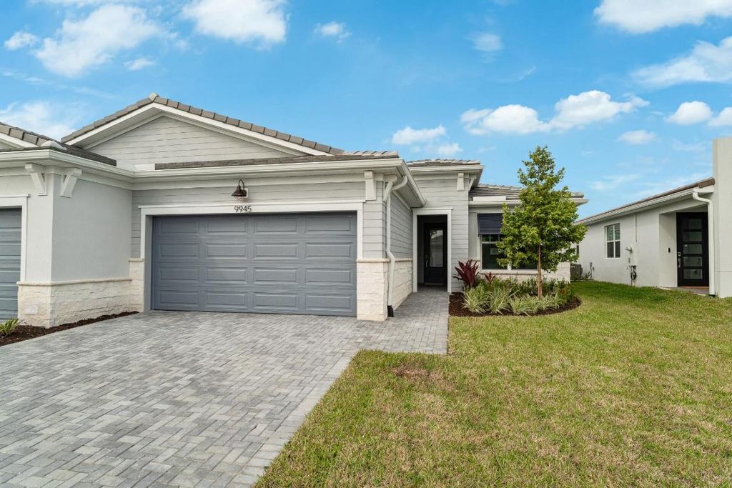 Photo of 9945 SW Isabelline Drive, Port Saint Lucie, FL 34987 (MLS # R10968762)