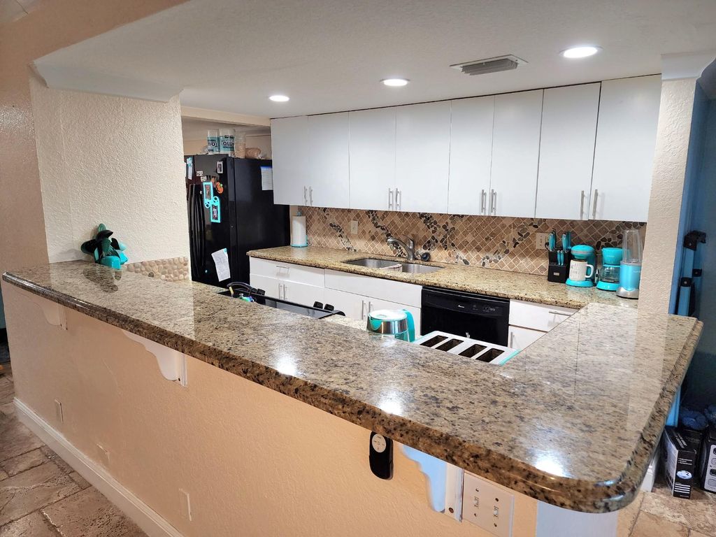 Photo of 2790 NW 80th Ave, Sunrise, FL 33322 (MLS # F10538224)