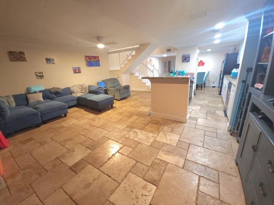 Beautifully renovated Sunrise Home, FHA Approved Offering over 1,600 sq ft of living space with impact doors/windows, Marble floors, Open Kitchen granite counter tops. Features include a 2021 Roof Replacement a 2020 A/C unit, New Air Ducts, New insulation for comfort and efficiency. Updated baths, 2 balcony's and a covered and screened-in patio, Garage previously converted great for a 4th bedroom or office space (easily restored).  A rare find and truly a must-see!