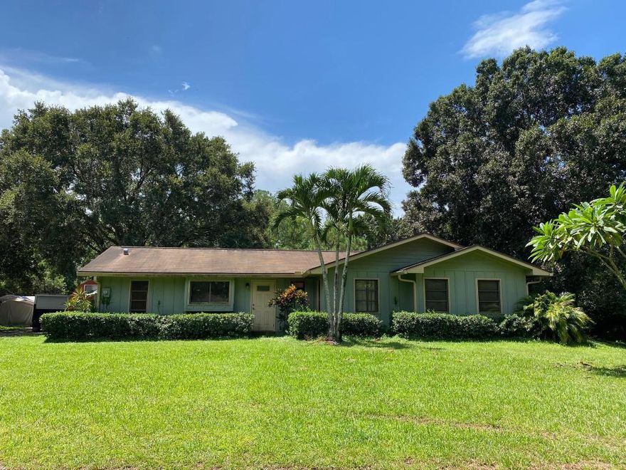 4 Bedroom 2 Bath home with large 40'x12' screened enclosed porch. Lots of storage with the detached garage and 1/1 efficiency apartment on top with a great screened in porch of its own! Property is completely fenced. Home needs updating and some TLC. Located one lot in from paved Randolph Siding Road. A++ schools, minutes from Jupiter beaches, the Loxahatchee River, Riverbend park, and shopping. TENANT OCCUPIED UNTIL 8/31