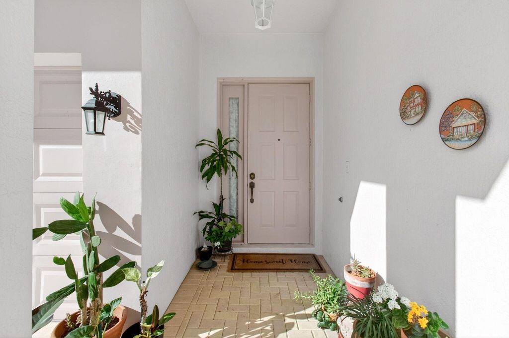 Photo of 9692 Sandpiper Lane, West Palm Beach, FL 33411 (MLS # B26008228)