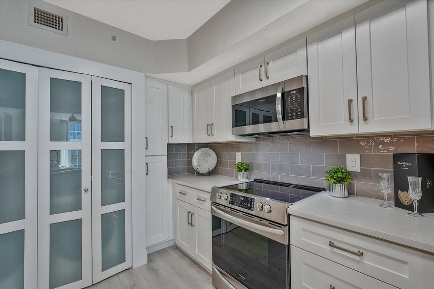 COMPLETELY RENOVATED! For those who are looking for perfection! 1,144 sq. ft.home is magnificent! 2 DEEDED GARAGE SPOTS #319 AND #268 provide anexceptional value! Southwest exposure brings in bright natural light! NEW AC,water heater ALL kitchen appliances and washer and dryer, faucets, and more! NEWContinuous vinyl flooring & ALL NEW lighting, switches and outlets throughout. Both bedrooms function as a private suite. Primary closet features CUSTOM DESIGNEDCABINETRY. Enjoy resort-style amenities, & all the excitement of downtown WestPalm Beach! Seller requests a closing after March 2, 2026. Audio and video surveillance is active in the home