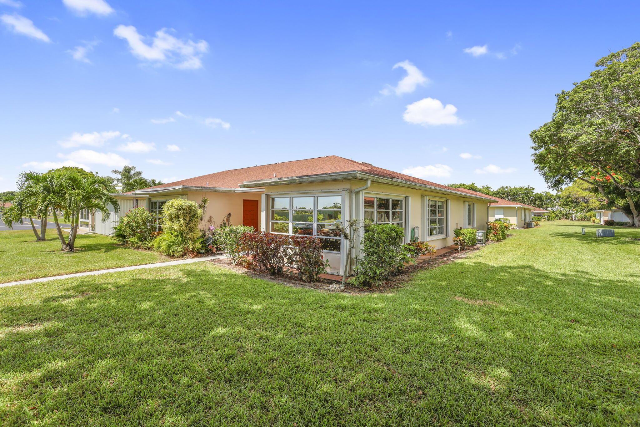 Garden villa, corner unit, bright, spacious 2 bedroom, 2 bath + den or office in prime Delray Beach location! Meticulously maintained tiled throughout, crown molding, newer stainless appliances, newer paint. 2023 Central Air.Master bedroom features a walk-in closet plus wall of closets.Enjoy your new, totally updated master bathroom with shower, new vanityLots of natural light-fills this home which features open & inviting layout, perfect for entertaining. A Florida sunroom ideal for lounging or a home office. Stay safe from storms with hurricane shutters (just serviced)Enjoy this quiet setting with open garden views. Located in one of the most sought-after sections, High Point Sec 7. Open backyard patio,Just a few steps away from the clubhouse