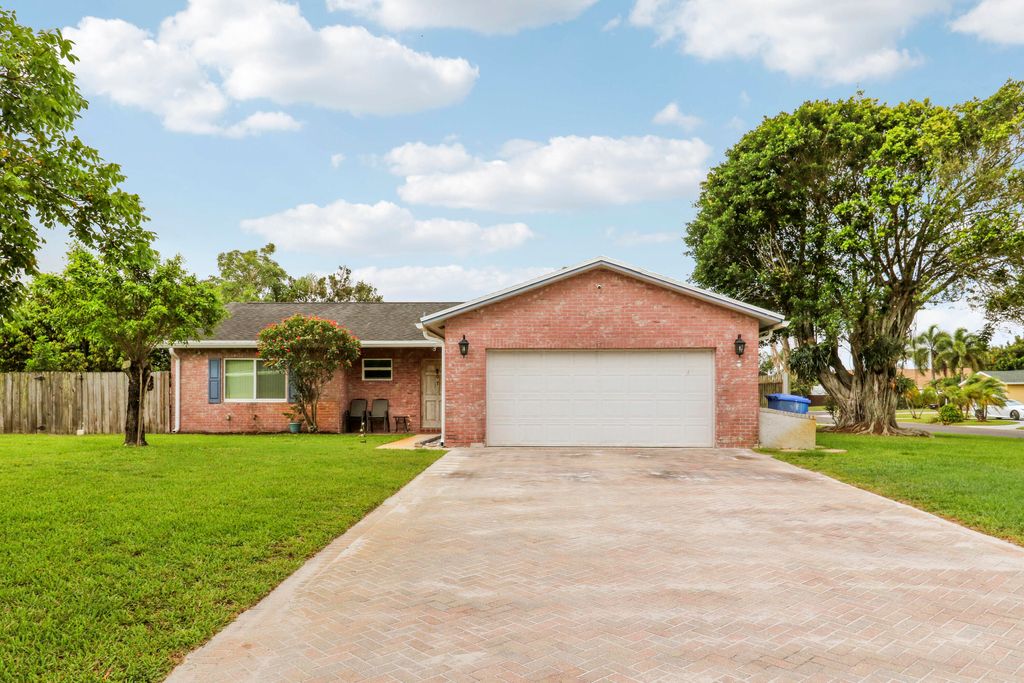 Photo of 98 Pintail Court, Royal Palm Beach, FL 33411 (MLS # B26034127)