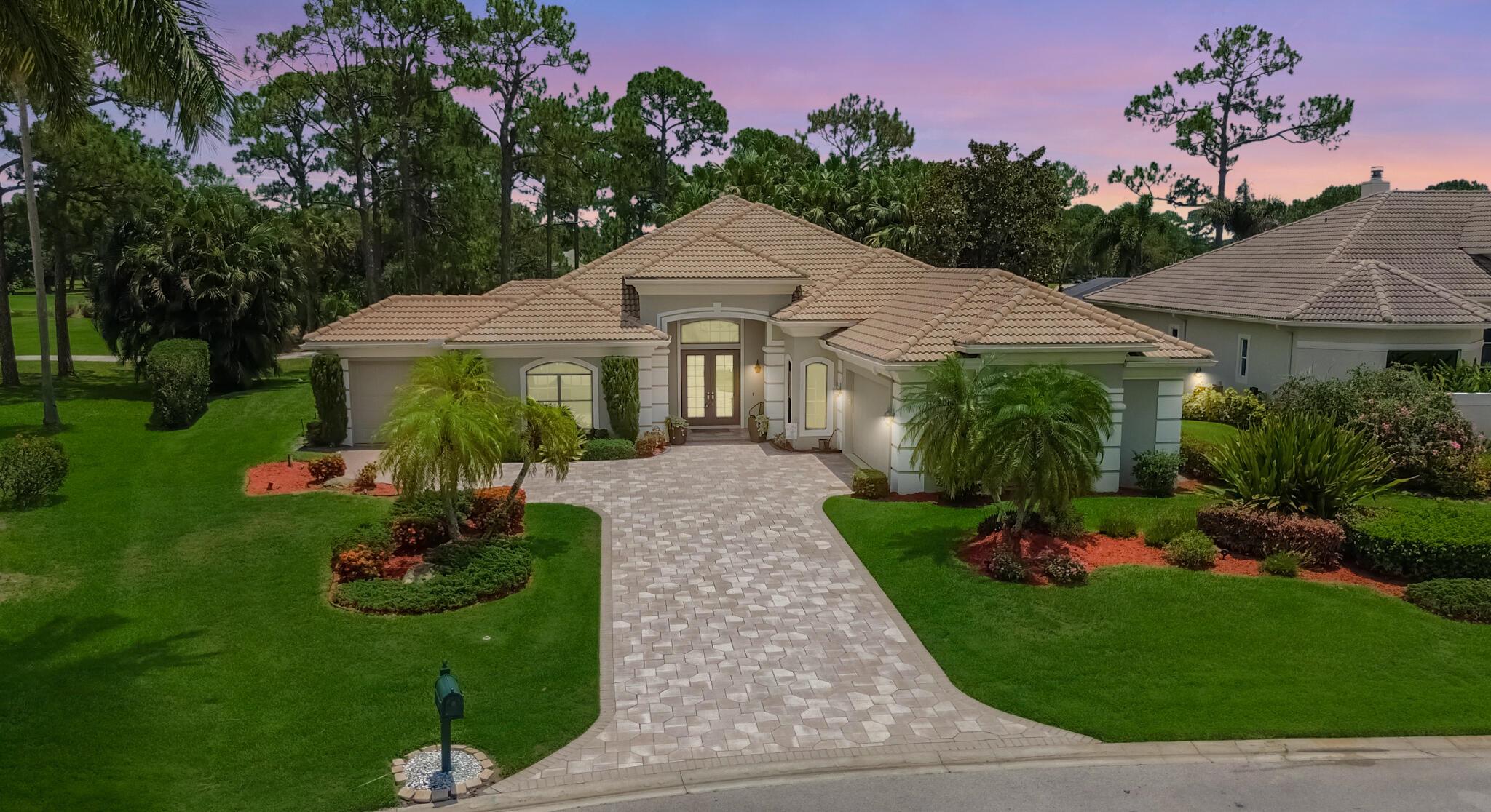 PGA Village, Pinehurst! Indulge in refined elegance with this exquisite 3BR/3BA/2.5 garage plus den/office, estate pool home located on the iconic PGA Ryder Course, 2nd green. A true masterpiece of luxury, this residence showcases soaring 18' coffered ceilings, rich wood and designer tile floors, custom crown molding, and timeless plantation shutters. The gourmet kitchen is a showstopper--featuring granite countertops, handcrafted wood cabinetry, a spacious walk-in pantry, and vented cooktop. Lavishly updated baths offer spa-like serenity. Step into a private outdoor sanctuary with a resort-style heated pool, bubbling spa, and sweeping golf course views. Aqualink controls, Whole house reverse osmosis system, backup genator. A golfer's dream and entertainer's paradise--luxury living!