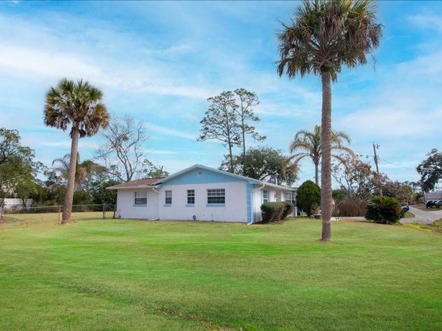 Beautiful corner-lot home in Palm Coast featuring a bright open layout and spacious living areas. The patio has been converted into two versatile bonus rooms—ideal for bedrooms, offices, or guest space. Major updates include new A/C, new water heater, new electrical panel, and roof only 2 years old. Property sits on a very large yard with plenty of room for entertaining or a future pool. No HOA. Conveniently located minutes from Walmart Supercenter - Palm Coast, Publix Super Market at Belle Terre Crossings, shopping, dining, and easy access to Interstate 95. Schedule your showing today and submit your offer!