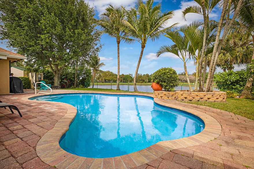 Beautiful CBS, 3-bedroom, 2-bath POOL home perfectly situated on a serene lake, offering both privacy and picturesque views. This property features a private pool oasis, ideal for relaxing or entertaining year-round. NEW ROOF in the works! Newer attic insulation (2023), NEW refrigerator (2023), NEW washer and dryer (2022)!  A spacious screened-in back room overlooking the pool, creating the perfect indoor-outdoor living experience. The home boasts a functional layout with great flow, making it comfortable for everyday living and gatherings alike. Don't miss this opportunity to enjoy peaceful waterfront living, perfectly complemented by desirable features and a prime location. Conveniently situated near major highways, top-rated hospitals, and beautiful, pristine beaches.