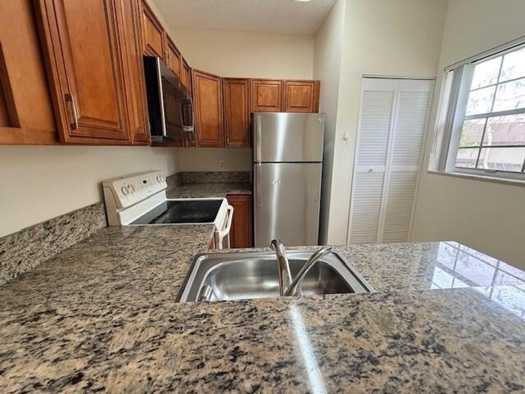 Photo of 671 Cypress Lake Boulevard #D21, Deerfield Beach, FL 33064 (MLS # B26025751)