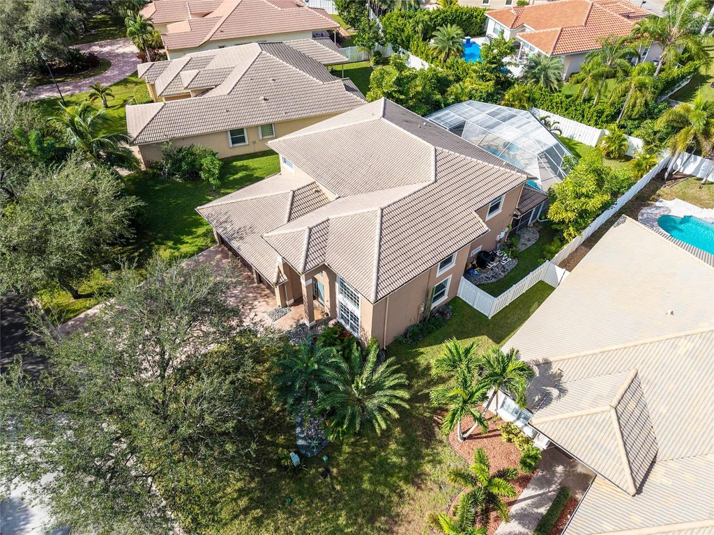 Photo of 5869 NW 56th Dr, Coral Springs, FL 33067 (MLS # F10534056)