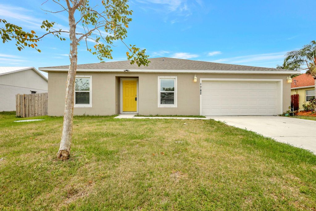 Photo of 1782 SE Ridgewood Street, Port Saint Lucie, FL 34952 (MLS # R10976769)